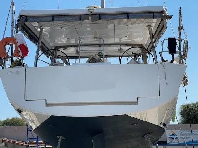  Yacht Photos Pics Dufour 512 Grand Large 2018 yacht, rear view, docked at marina.