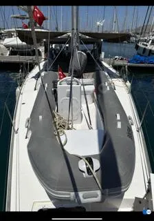  Yacht Photos Pics 2018 Dufour 512 Grand Large yacht with inflatable dinghy on deck, docked at marina.
