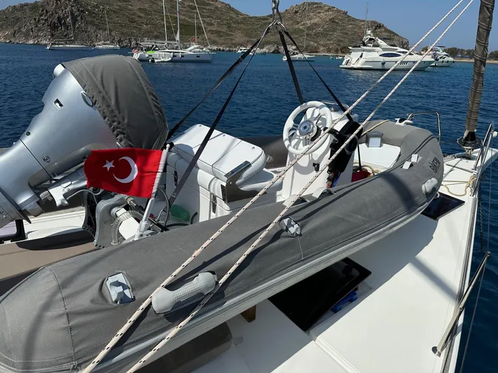  Yacht Photos Pics Sailing yacht Dufour 512 Grand Large 2018 with Turkish flag, anchored in scenic bay.