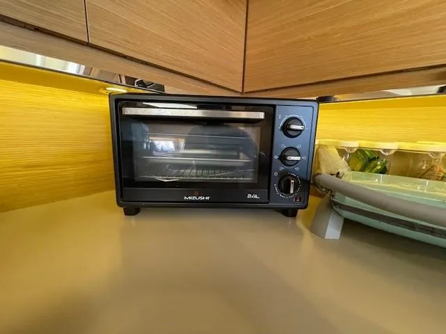  Yacht Photos Pics Compact black toaster oven on a Dufour 512 Grand Large yacht kitchen counter.