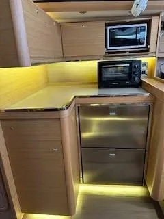  Yacht Photos Pics 2018 Dufour 512 Grand Large yacht kitchen with modern appliances and ambient lighting.