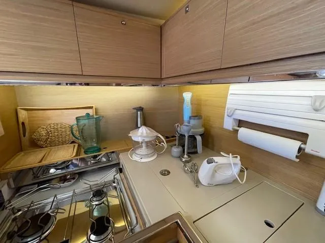  Yacht Photos Pics Modern kitchen in 2018 Dufour 512 Grand Large yacht with appliances and wooden cabinetry.