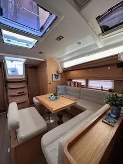  Yacht Photos Pics Interior of 2018 Dufour 512 Grand Large yacht with elegant seating and skylights.