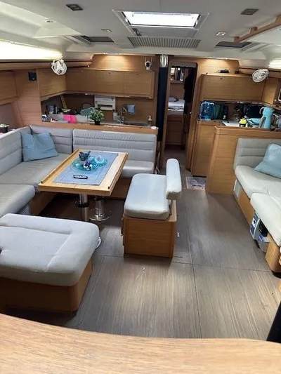  Yacht Photos Pics Spacious interior of 2018 Dufour 512 Grand Large yacht with modern furnishings.