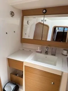 Yacht Photos Pics Modern bathroom in 2018 Dufour 512 Grand Large yacht with wood accents and mirror.