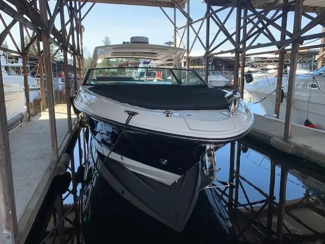  Yacht Photos Pics 2022 Sea Ray SLX 400 boat docked in marina, covered and ready for use.