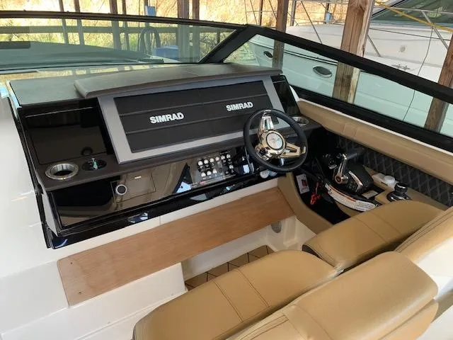  Yacht Photos Pics 2022 Sea Ray SLX 400 helm with dual Simrad displays and tan seating.