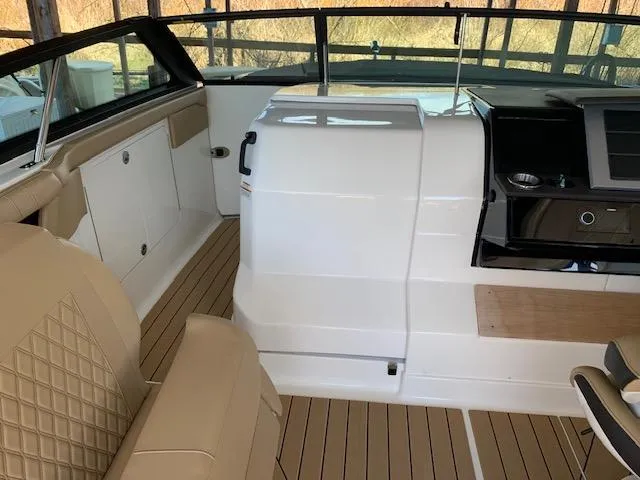  Yacht Photos Pics 2022 Sea Ray SLX 400 boat interior with beige seating and modern dashboard.
