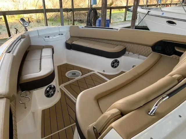  Yacht Photos Pics Luxurious 2022 Sea Ray SLX 400 boat interior with tan seating and wood flooring.