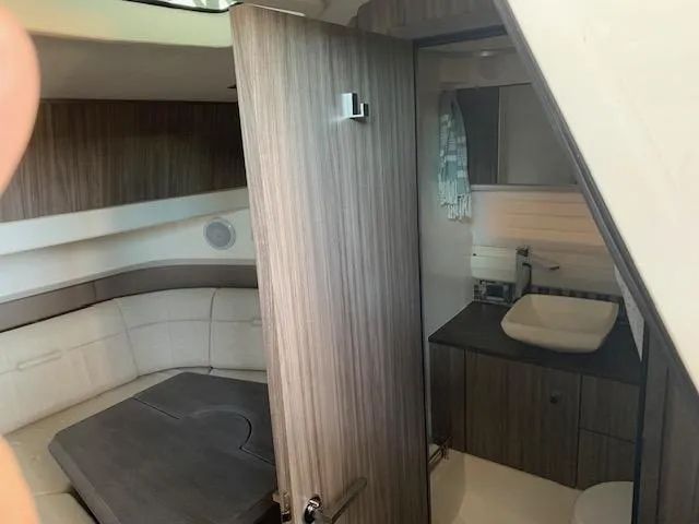  Yacht Photos Pics Interior of 2022 Sea Ray SLX 400 yacht with modern cabin and bathroom.