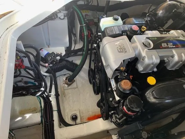  Yacht Photos Pics Engine compartment of 2022 Sea Ray SLX 400 boat, showcasing detailed mechanical components.