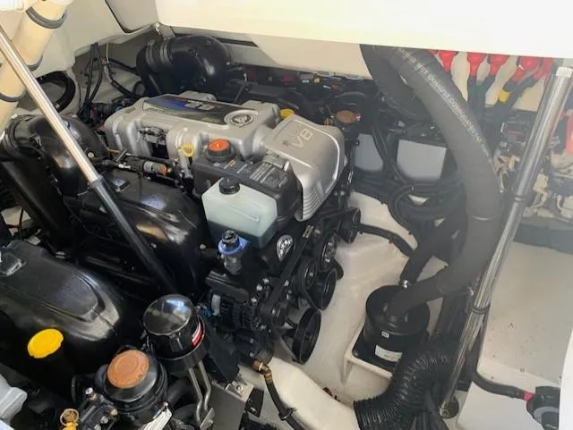  Yacht Photos Pics Engine compartment of a 2022 Sea Ray SLX 400 boat, showcasing mechanical components.