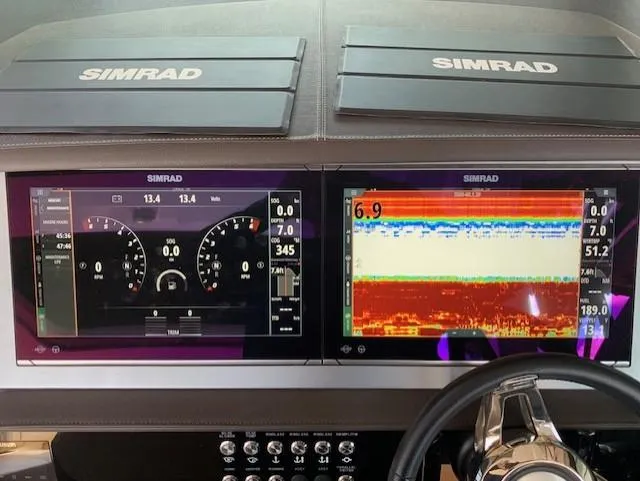  Yacht Photos Pics Simrad navigation displays on 2022 Sea Ray SLX 400 boat dashboard.