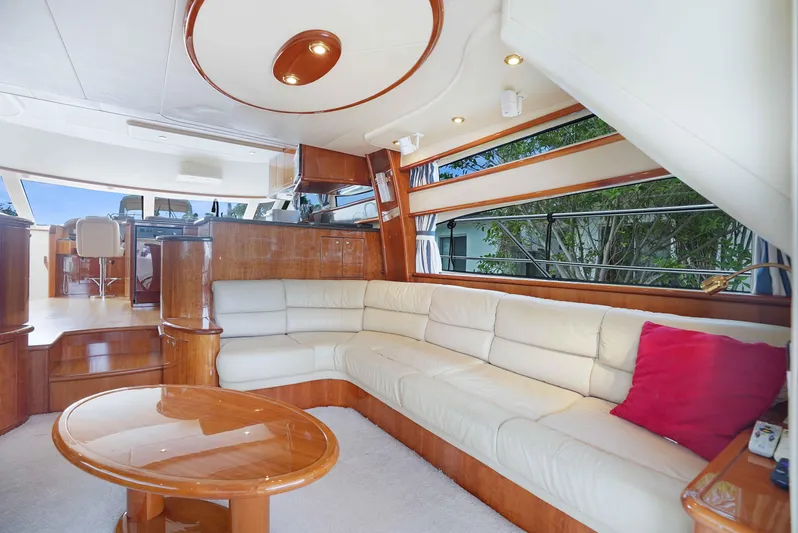 Carrie Ann Yacht Photos Pics Luxurious interior of 2006 Neptunus 62 Flybridge yacht with cream leather seating.