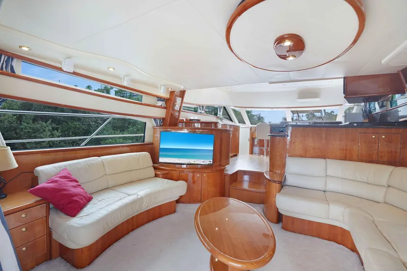 Carrie Ann Yacht Photos Pics Luxurious 2006 Neptunus 62 Flybridge yacht interior with elegant seating and modern amenities.