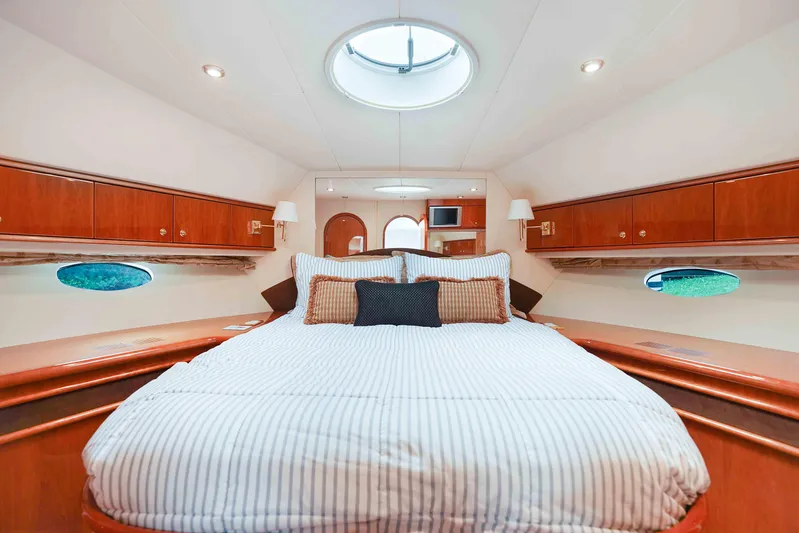 Carrie Ann Yacht Photos Pics Luxurious cabin interior of 2006 Neptunus 62 Flybridge yacht with elegant wood finish.