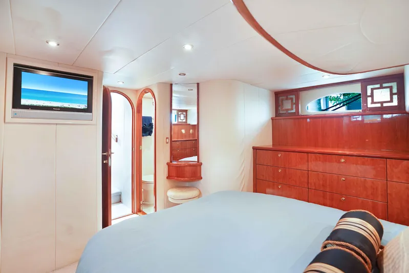 Carrie Ann Yacht Photos Pics Luxurious cabin interior of 2006 Neptunus 62 Flybridge yacht with elegant wood finishes.