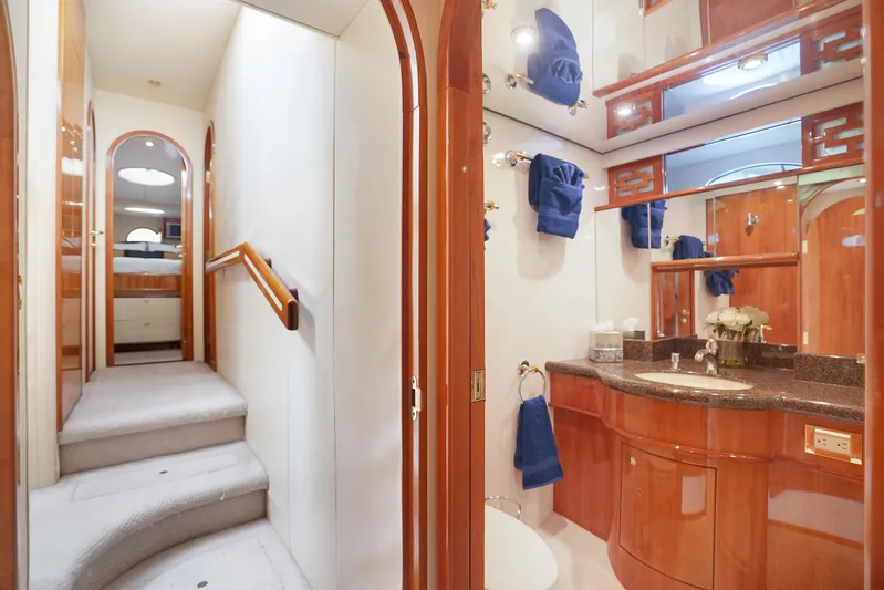 Carrie Ann Yacht Photos Pics Luxurious 2006 Neptunus 62 Flybridge yacht interior with elegant bathroom and staircase.