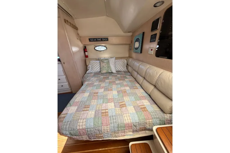 Big Time Yacht Photos Pics Cozy cabin interior of 1996 Tiara Yachts 3500 Express with quilted bedspread.