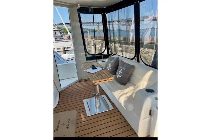 Our Turn Yacht Photos Pics 2001 Carver 396 Aft Cabin Motor Yacht interior with seating and table.