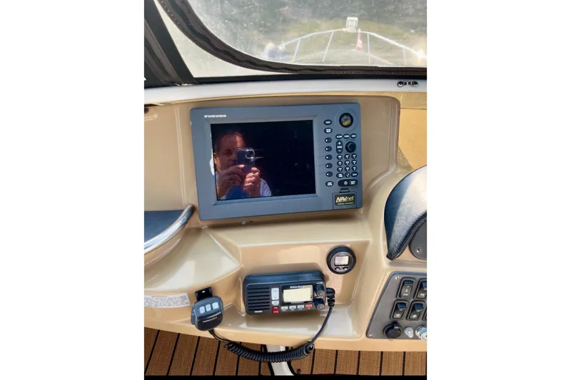 Our Turn Yacht Photos Pics Control panel of 2001 Carver 396 Aft Cabin Motor Yacht with navigation equipment.