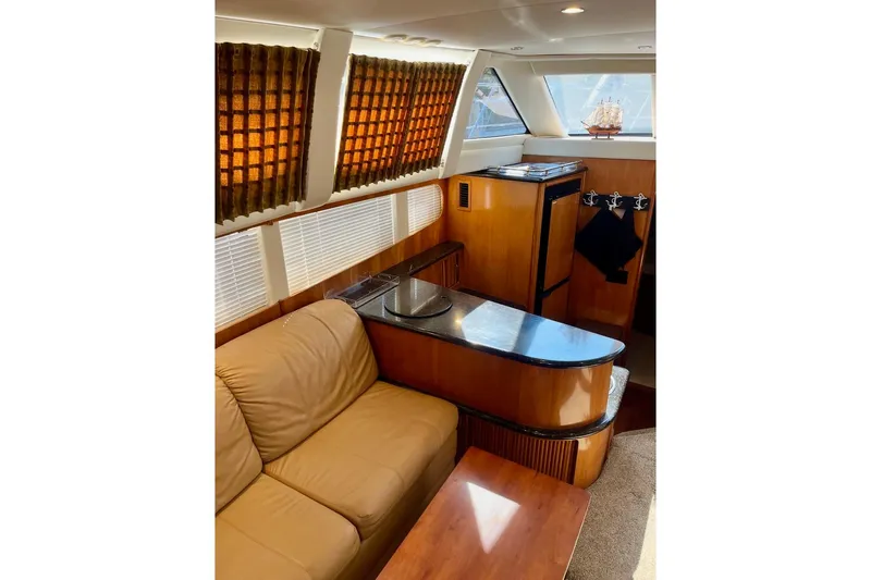 Our Turn Yacht Photos Pics Interior of 2001 Carver 396 Aft Cabin Motor Yacht with leather seating and wood accents.