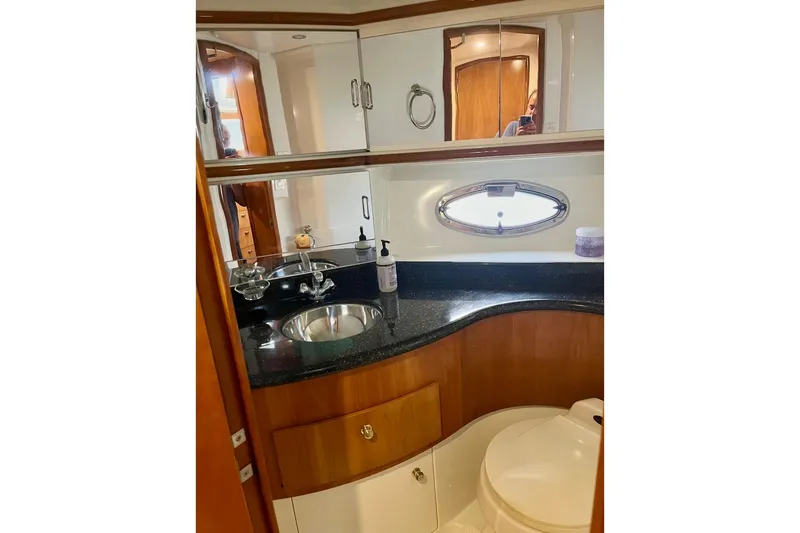 Our Turn Yacht Photos Pics Luxurious bathroom in 2001 Carver 396 Aft Cabin Motor Yacht with sleek design.