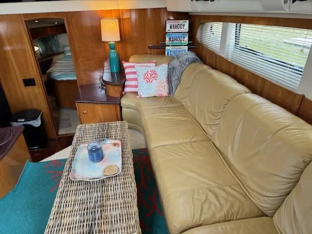 Wahooy Yacht Photos Pics Luxurious 2001 Carver 396 Motoryacht interior with leather seating and nautical decor.