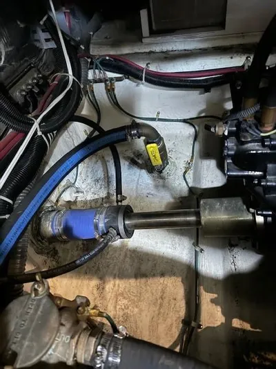 Wahooy Yacht Photos Pics Engine compartment of a 2001 Carver 396 Motoryacht, showing mechanical components and hoses.