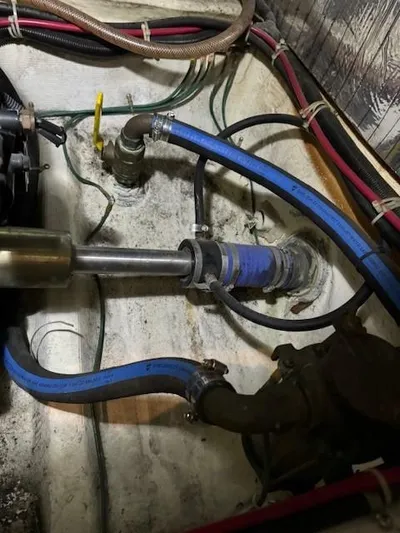 Wahooy Yacht Photos Pics Engine compartment of 2001 Carver 396 Motoryacht with visible hoses and fittings.