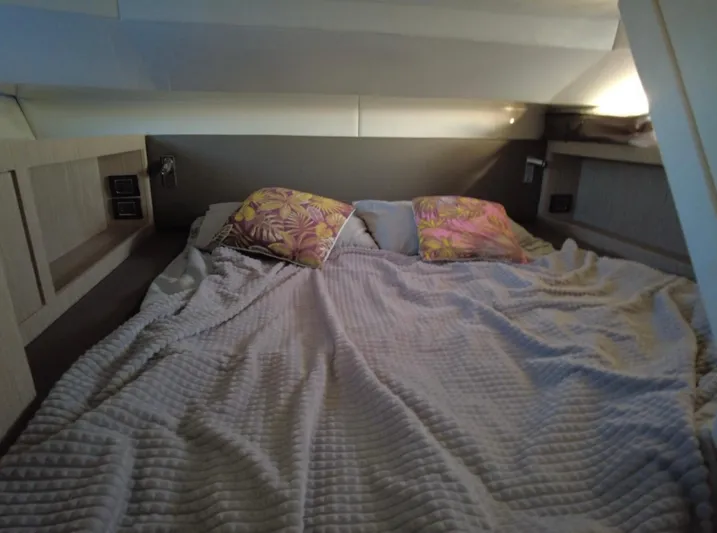  Yacht Photos Pics Cozy cabin interior of 2022 Sessa Marine Key Largo 40 with plush bedding and pillows.