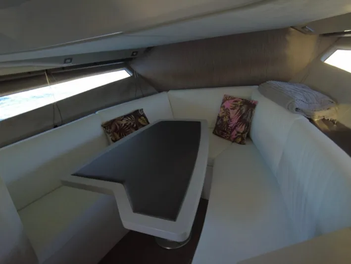  Yacht Photos Pics Interior of 2022 Sessa Marine Key Largo 40 with white seating and decorative pillows.