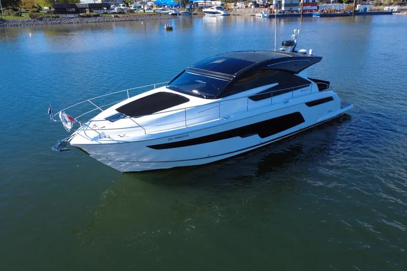  Yacht Photos Pics 2023 Fairline Targa 50 yacht on calm water, showcasing sleek design and modern features.
