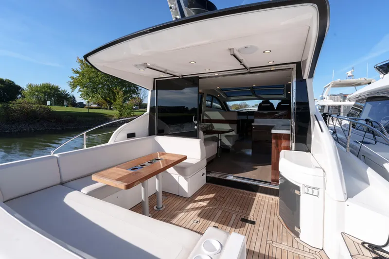  Yacht Photos Pics 2023 Fairline Targa 50 yacht with elegant outdoor seating and sleek interior design.