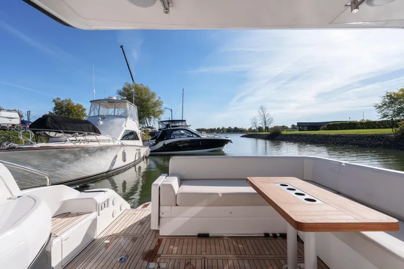  Yacht Photos Pics 2023 Fairline Targa 50 yacht interior with scenic marina view.