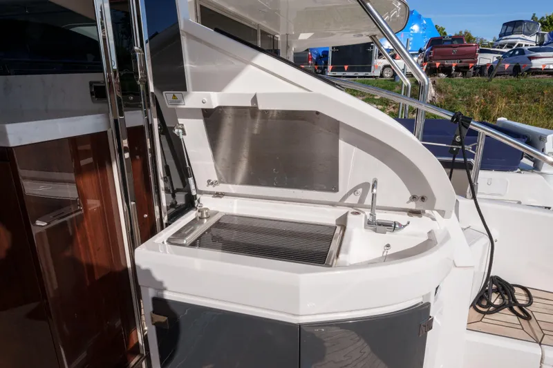  Yacht Photos Pics Outdoor kitchen area on a 2023 Fairline Targa 50 yacht, featuring a grill and sink.