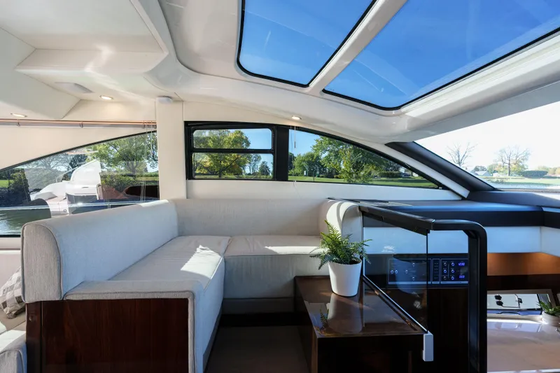  Yacht Photos Pics Luxurious interior of 2023 Fairline Targa 50 yacht with panoramic windows and modern design.