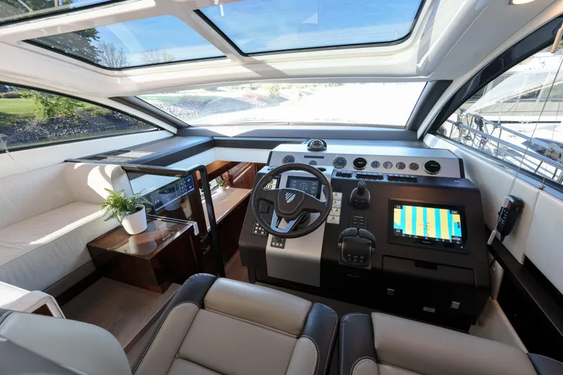  Yacht Photos Pics Luxurious 2023 Fairline Targa 50 yacht interior with modern helm and panoramic windows.