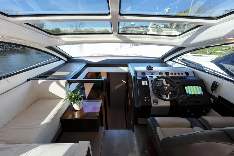  Yacht Photos Pics 2023 Fairline Targa 50 yacht interior with modern helm and panoramic windows.