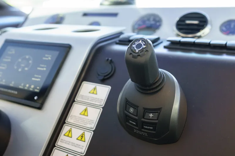 Yacht Photos Pics Control panel of 2023 Fairline Targa 50 yacht with joystick and display.