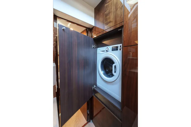  Yacht Photos Pics 2023 Fairline Targa 50 yacht interior with built-in washing machine.
