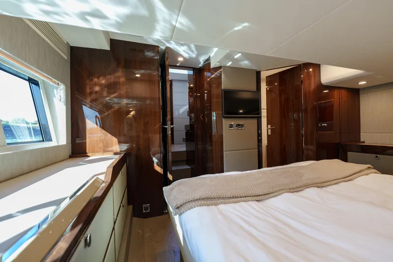  Yacht Photos Pics Luxurious interior of 2023 Fairline Targa 50 yacht bedroom with modern design.