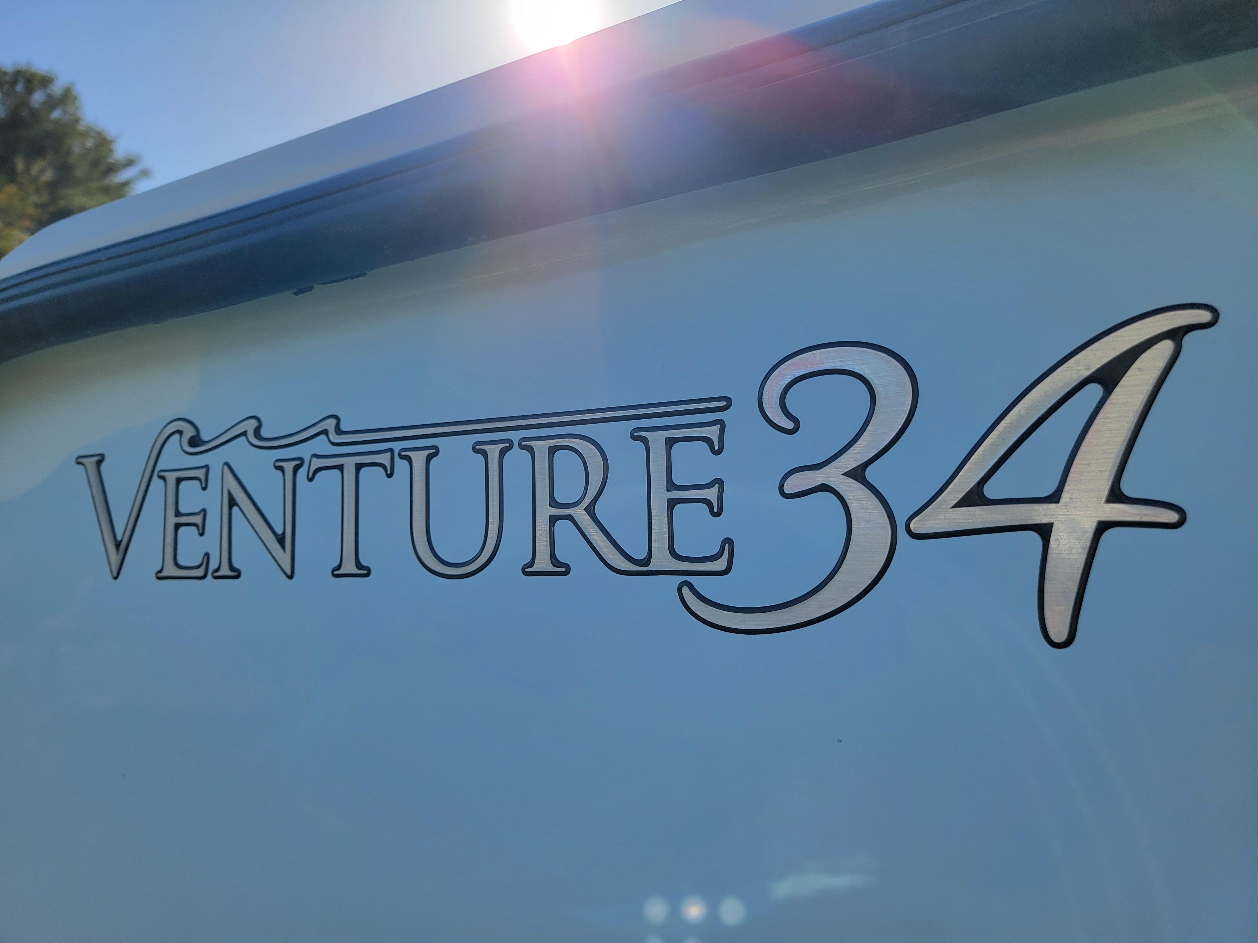 1996 Venture 34 Center Console boat logo in sunlight.