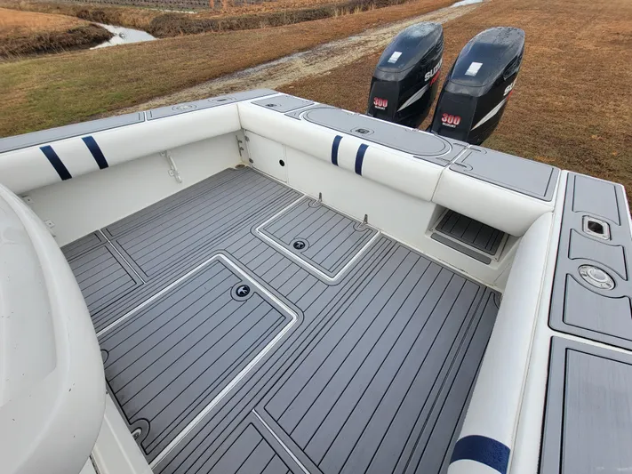  Yacht Photos Pics 1996 Venture 34 Center Console boat with dual outboard motors, spacious deck, and cushioned seating.