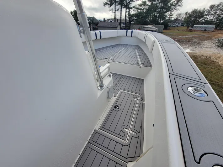  Yacht Photos Pics 1996 Venture 34 Center Console boat deck with sleek design and modern fittings.