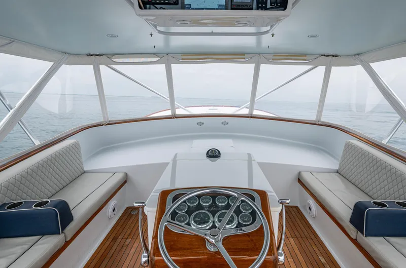  Yacht Photos Pics Interior view of 2005 Gamefisherman 45 Express yacht with elegant seating and steering wheel.