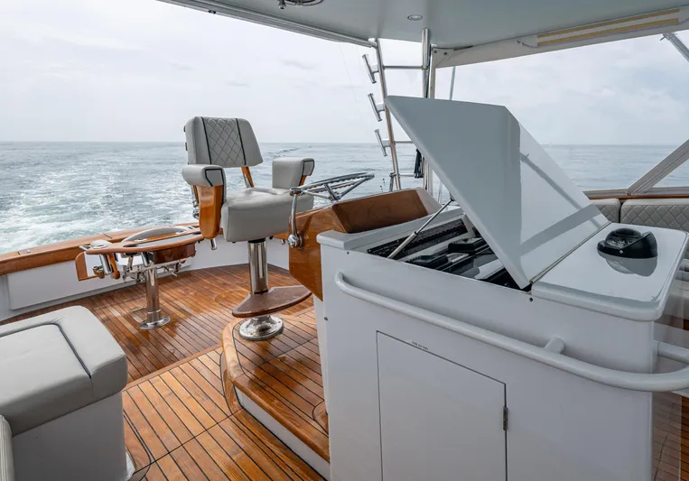  Yacht Photos Pics 2005 Gamefisherman 45 Express yacht interior with wooden deck and seating.