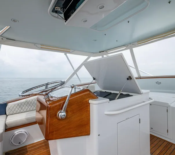  Yacht Photos Pics 2005 Gamefisherman 45 Express yacht interior with wooden helm and open hatch.