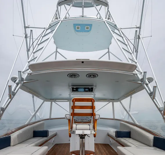  Yacht Photos Pics 2005 Gamefisherman 45 Express boat interior with seating and helm station.