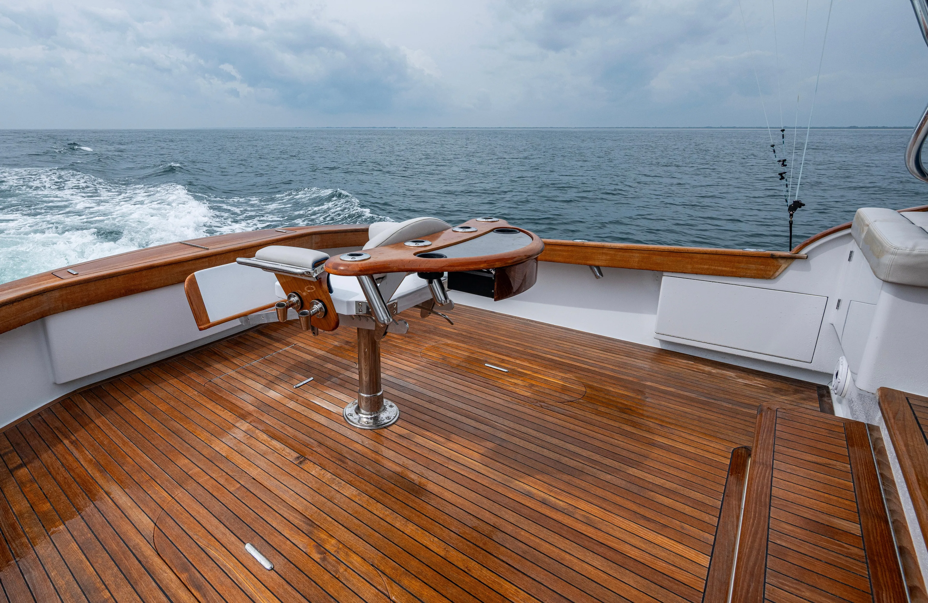  Yacht Photos Pics 2005 Gamefisherman 45 Express boat with wooden deck, ocean view, and fishing chair.